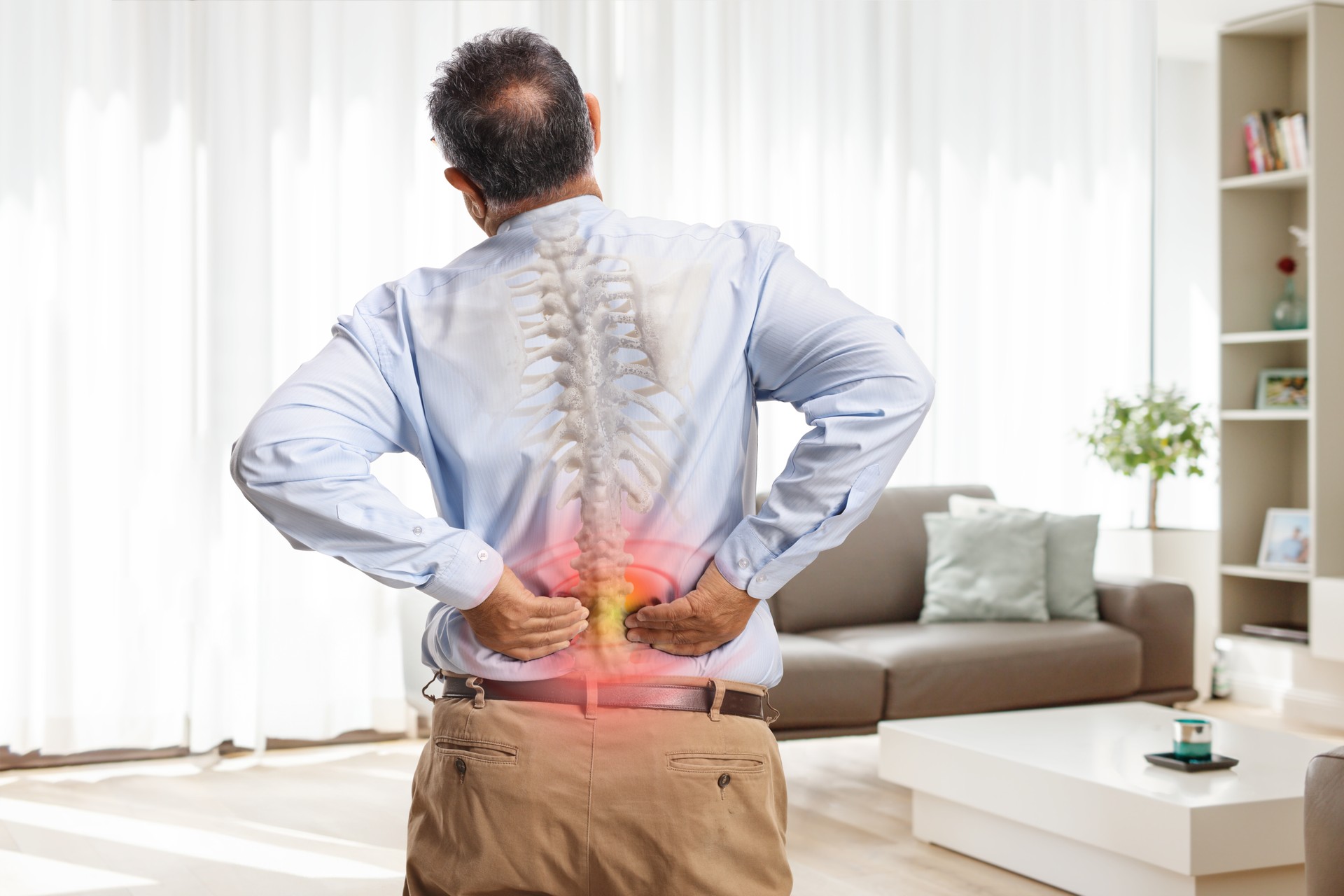 Man with osteoarthritis suffering from back pain